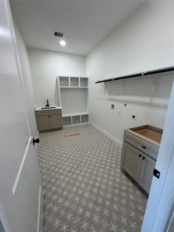 a kitchen with granite countertop a refrigerator and a stove