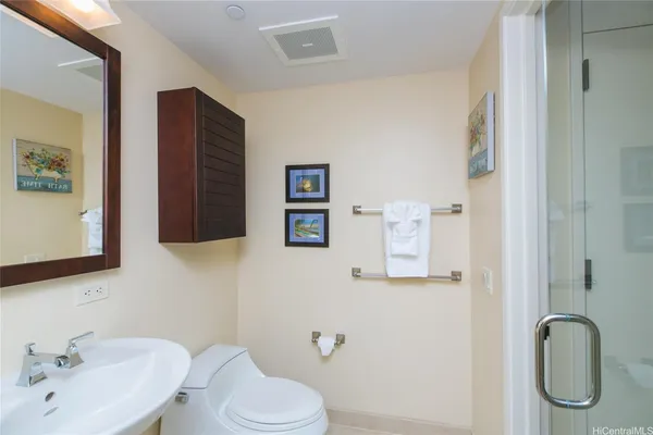a bathroom with a window and a shower