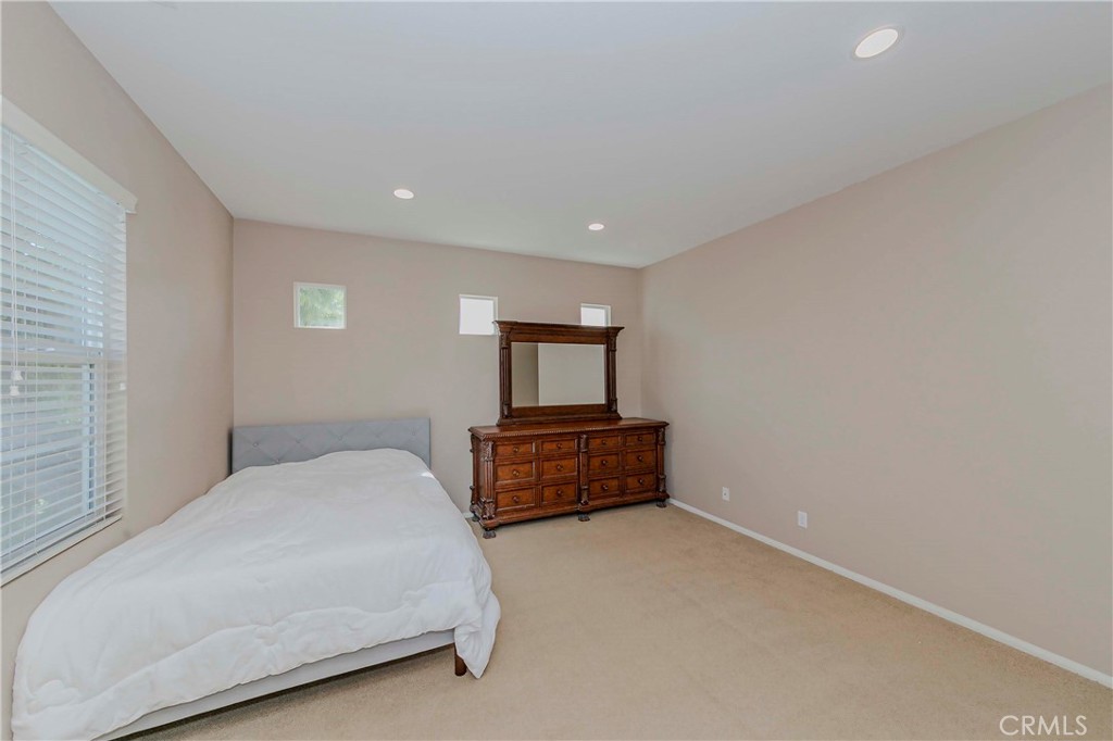 67 Canopy Irvine, CA 92603 - Photo 17 of 47 a bedroom with a bed and window