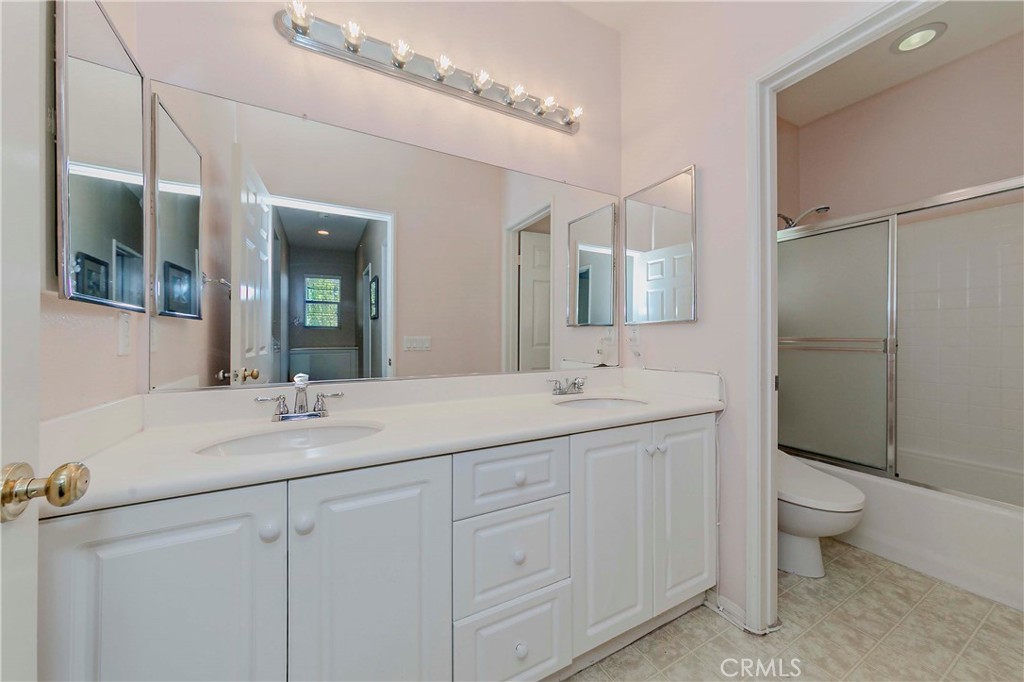 67 Canopy Irvine, CA 92603 - Photo 26 of 47 a bathroom with a double vanity sink mirror and toilet