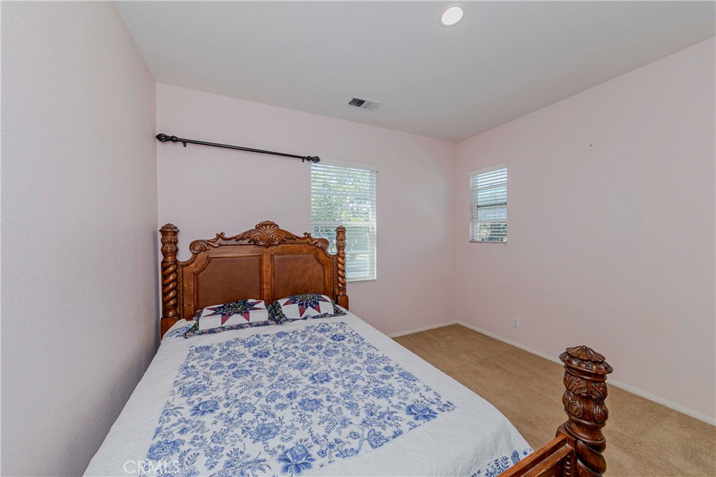 67 Canopy Irvine, CA 92603 - Photo 28 of 47 a room with a bed and a chair