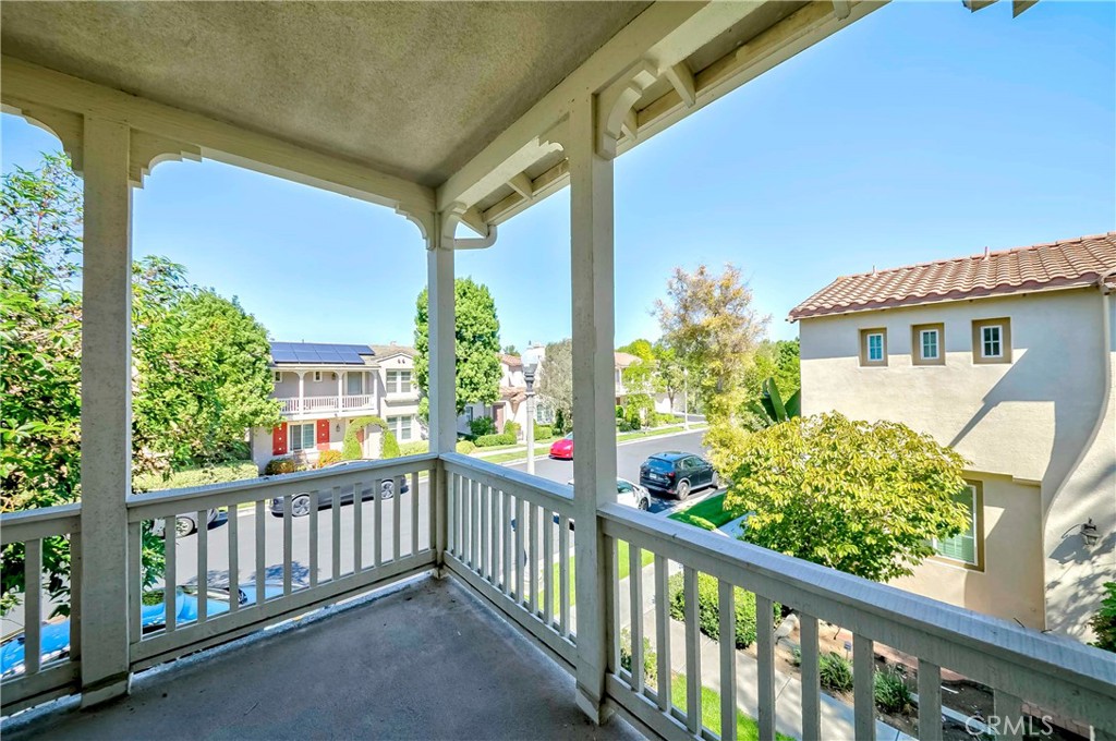 67 Canopy Irvine, CA 92603 - Photo 31 of 47 a view of a porch with a floor to ceiling window and wooden fence