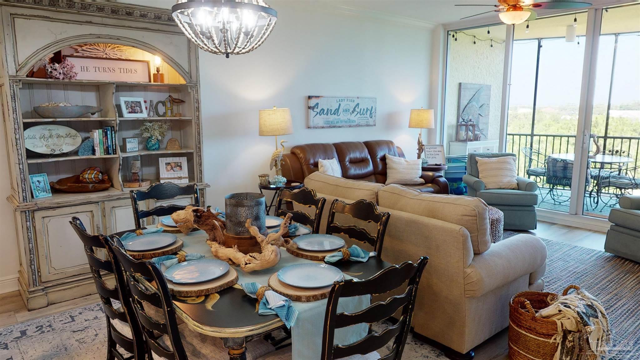 608 Lost Key Drive, Unit 404C Perdido Key, FL 32507 - Photo 6 of 28 a dining room with furniture and a window