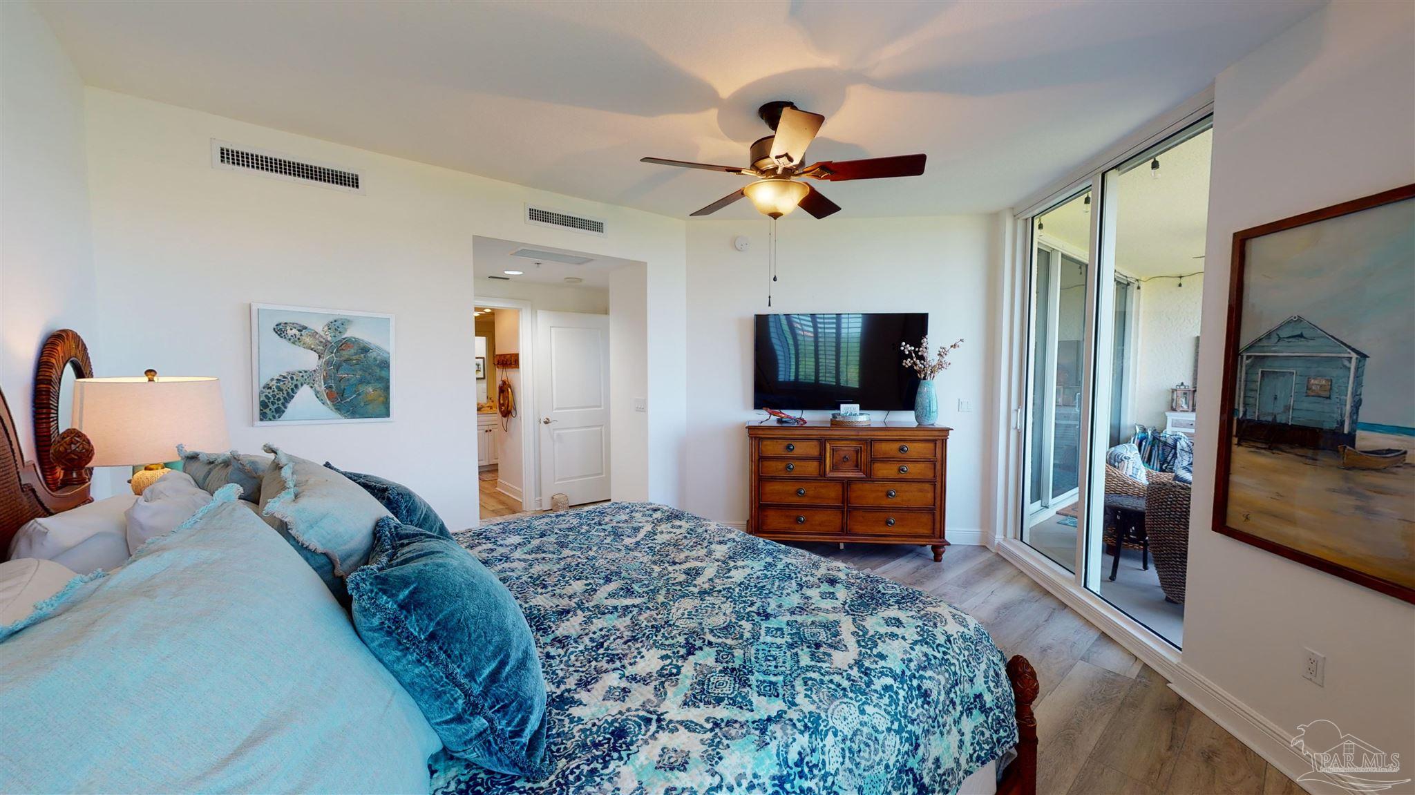 608 Lost Key Drive, Unit 404C Perdido Key, FL 32507 - Photo 9 of 28 a bedroom with a bed and a dresser in it