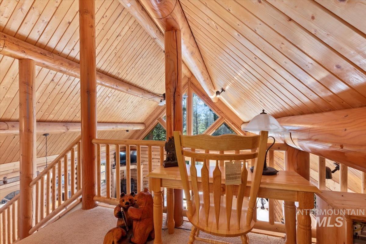 10 Elk Point Road Garden Valley, ID 83622 - Photo 26 of 42 Interior space with a wood ceiling with exposed beams and carpet flooring