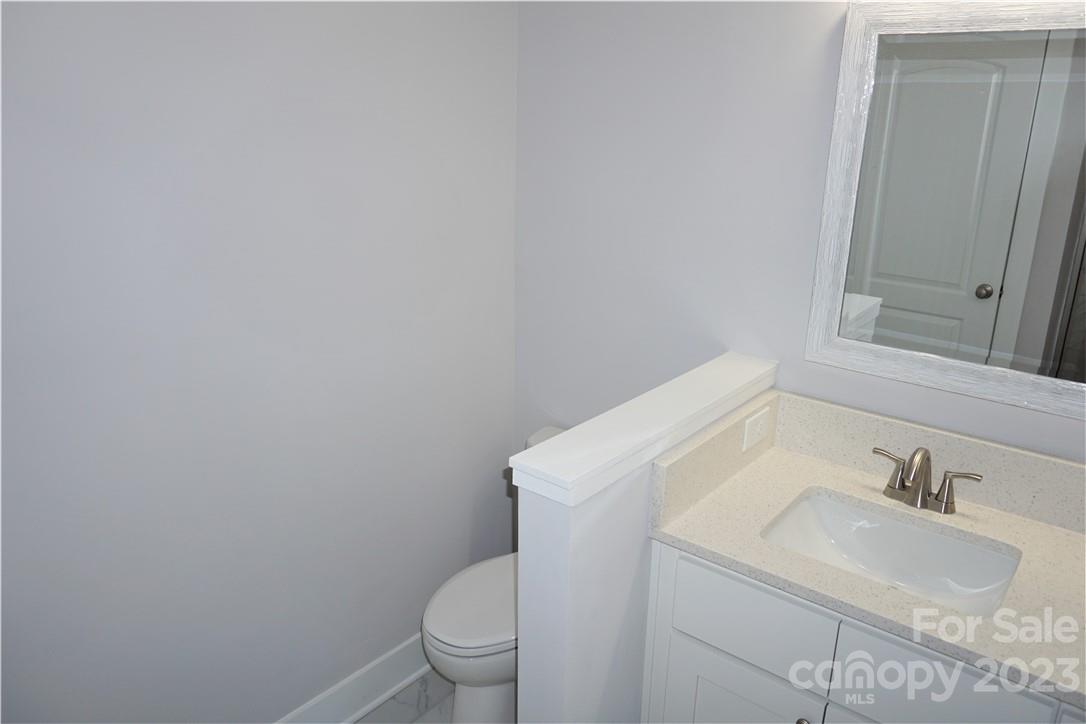 1048 McLain Road Kannapolis, NC 28083 - Photo 20 of 31 a bathroom with a sink and a toilet