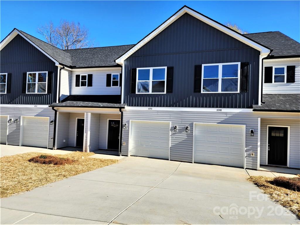 1048 McLain Road Kannapolis, NC 28083 - Photo 2 of 31 a view of a house with a yard