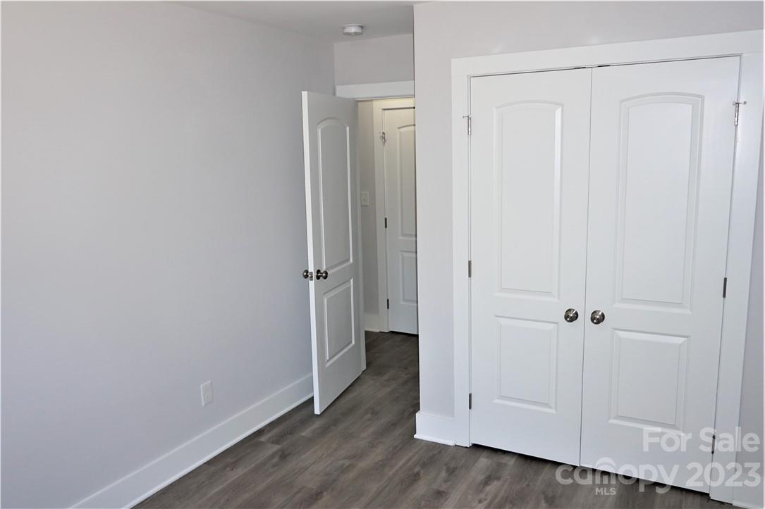 1048 McLain Road Kannapolis, NC 28083 - Photo 28 of 31 an empty room with wooden floor