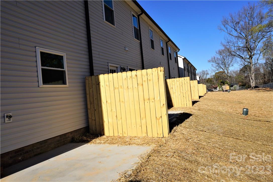 1048 McLain Road Kannapolis, NC 28083 - Photo 5 of 31 a view of a house with a yard