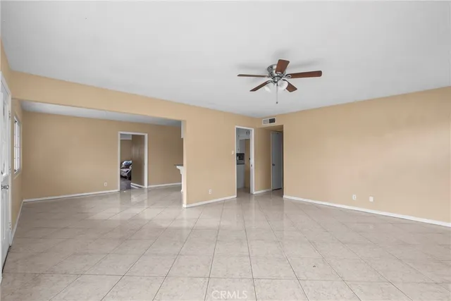 a kitchen with stainless steel appliances a refrigerator sink and white cabinets