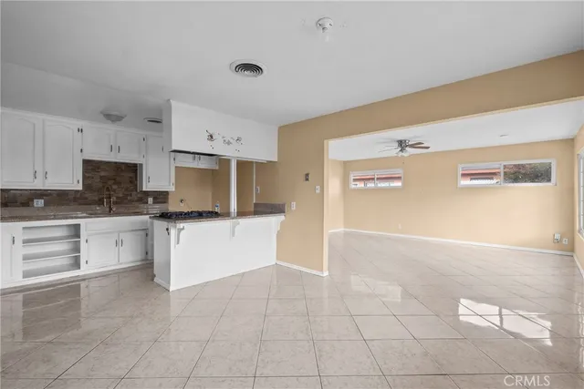 a kitchen with cabinets and appliances