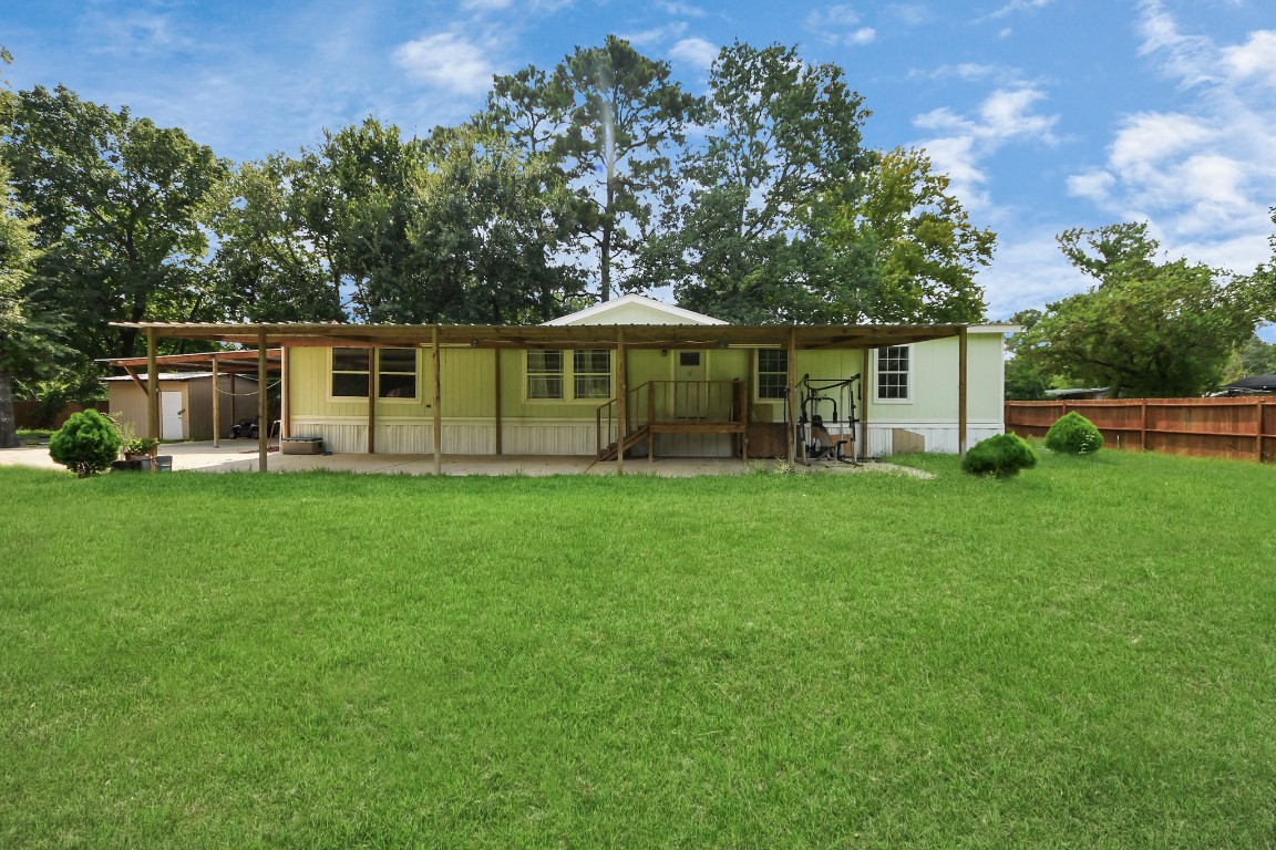 11844 Padok Road Houston, TX 77044 - Photo 12 of 41 a view of a house with backyard porch and sitting area