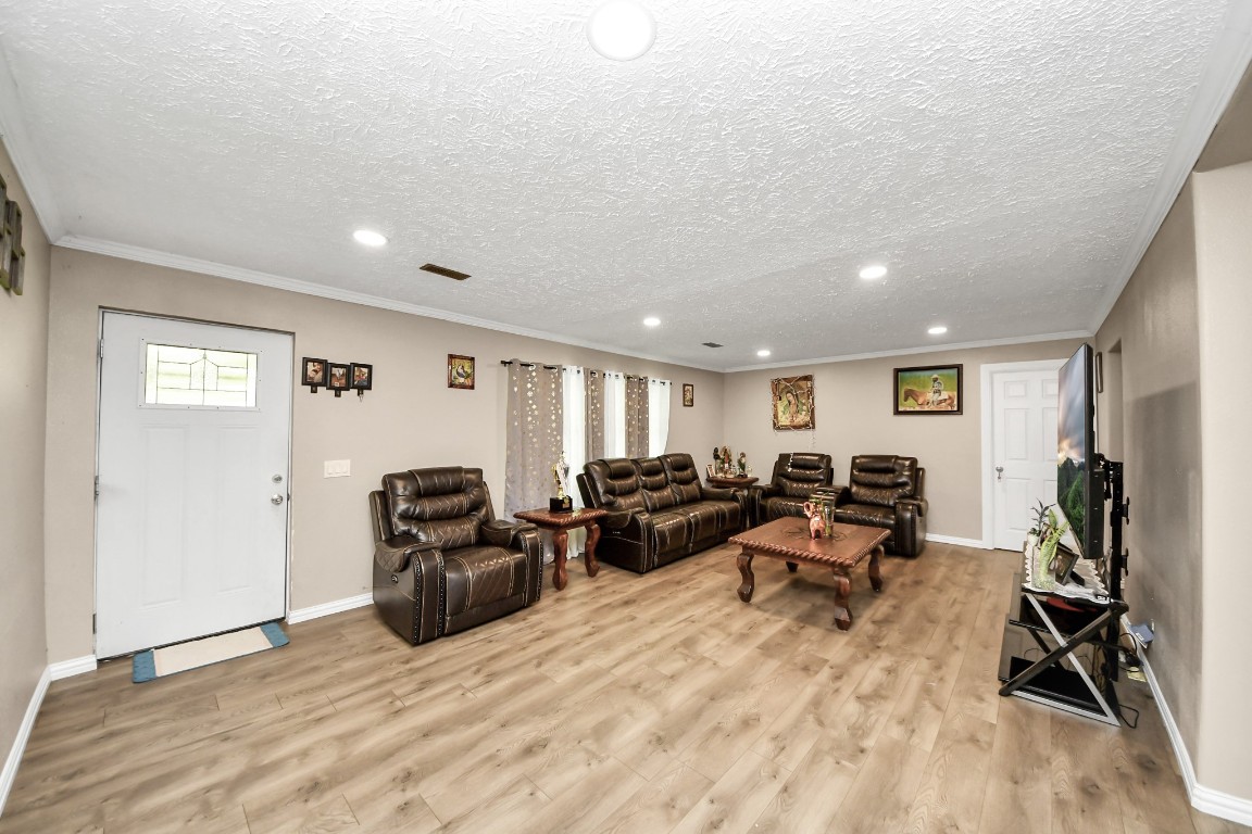 11844 Padok Road Houston, TX 77044 - Photo 13 of 41 a living room with furniture window and a flat screen tv
