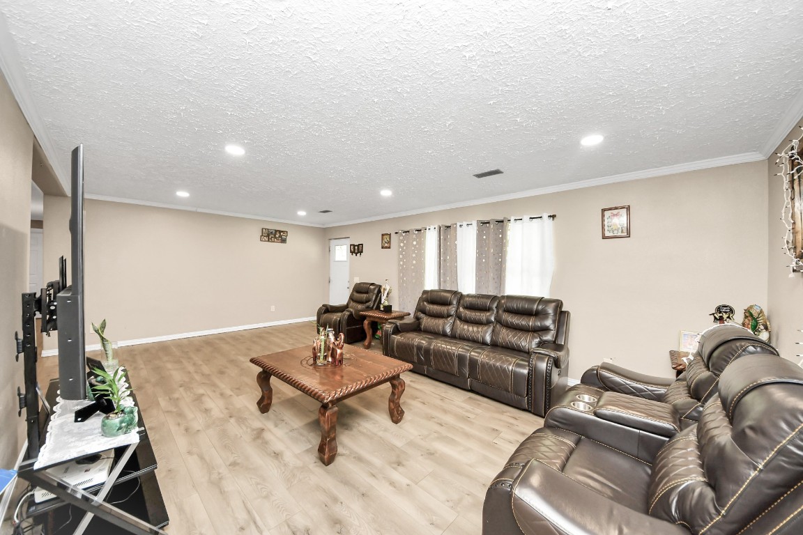 11844 Padok Road Houston, TX 77044 - Photo 14 of 41 a living room with furniture and wooden floor