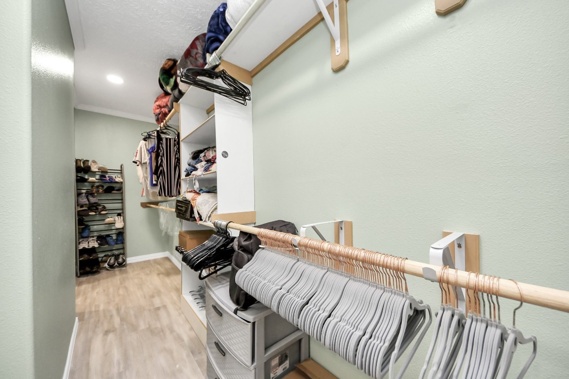 11844 Padok Road Houston, TX 77044 - Photo 30 of 41 a bedroom with furniture and a wooden floor