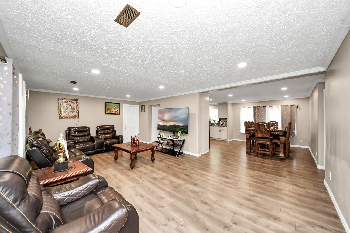 11844 Padok Road Houston, TX 77044 - Photo 3 of 41 a living room with furniture and wooden floor