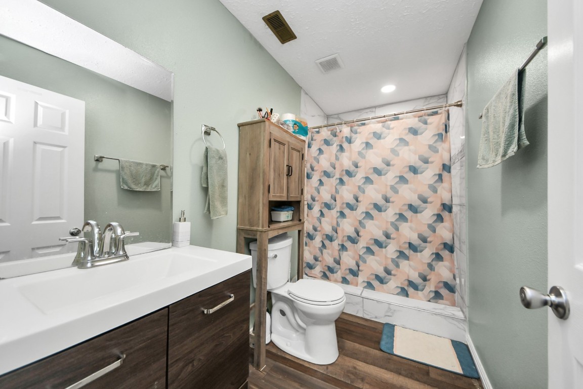 11844 Padok Road Houston, TX 77044 - Photo 32 of 41 a bathroom with a sink toilet and shower