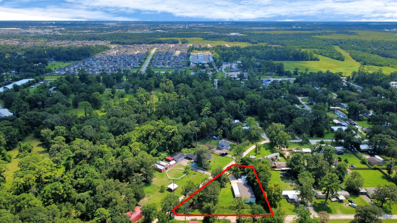 11844 Padok Road Houston, TX 77044 - Photo 40 of 41 a view of a lake with a mountain in the back