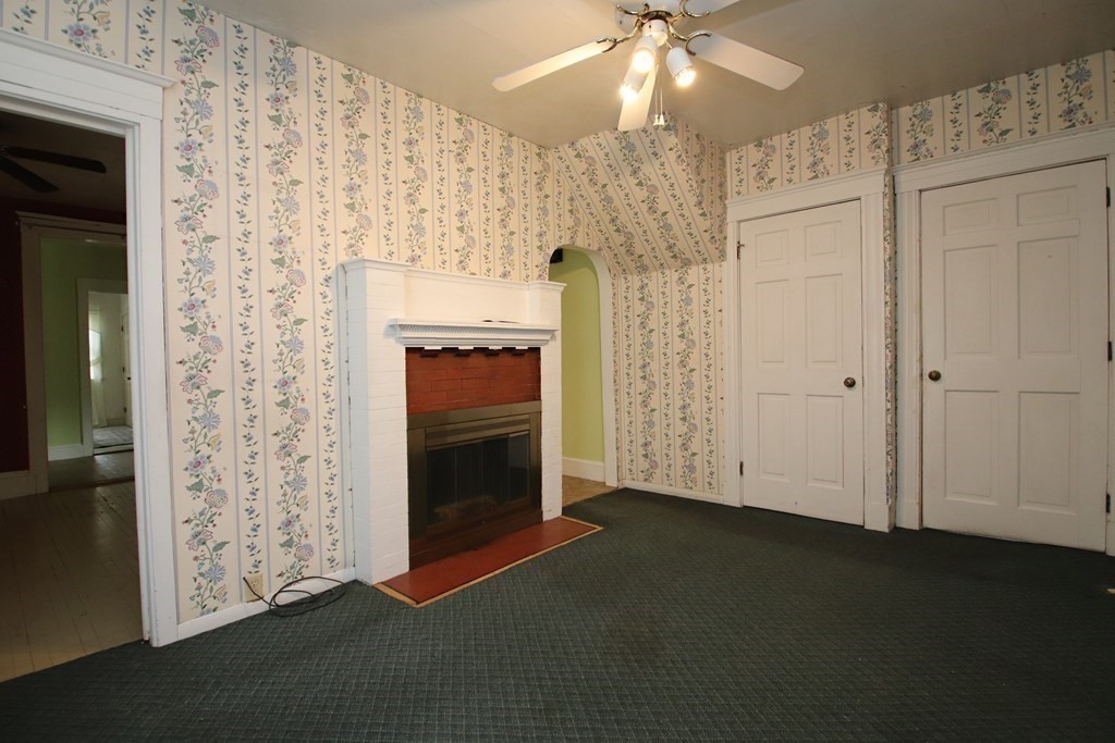 3 Linwood Street Saugus, MA 01906 - Photo 12 of 42 an empty room with windows and fireplace