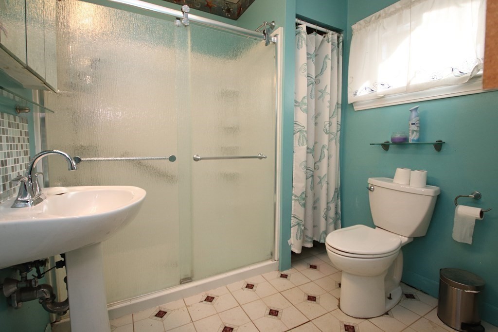 3 Linwood Street Saugus, MA 01906 - Photo 16 of 42 a bathroom with a sink toilet and shower