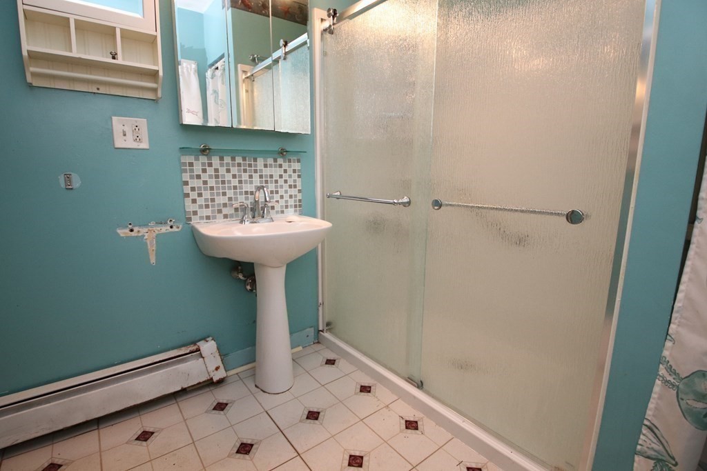 3 Linwood Street Saugus, MA 01906 - Photo 18 of 42 a bathroom with a sink a toilet and a shower
