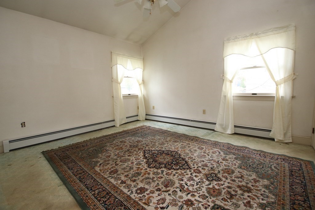 3 Linwood Street Saugus, MA 01906 - Photo 19 of 42 an empty room with wooden floor and windows
