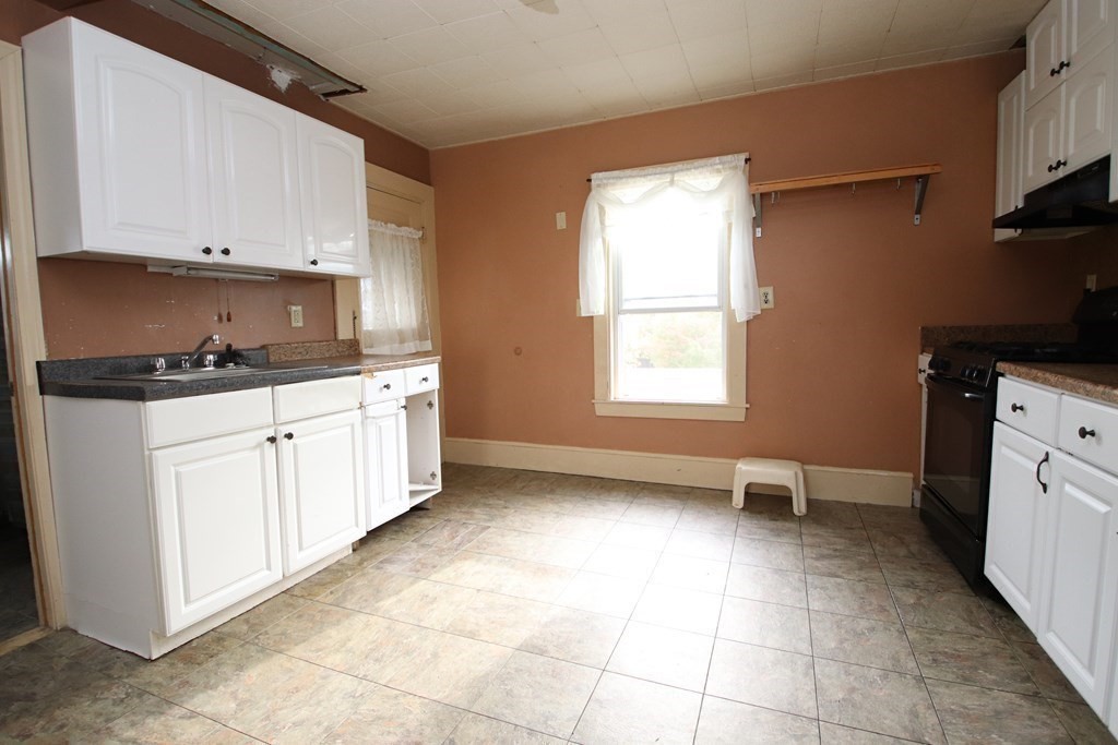 3 Linwood Street Saugus, MA 01906 - Photo 23 of 42 a kitchen with a sink a stove and cabinets
