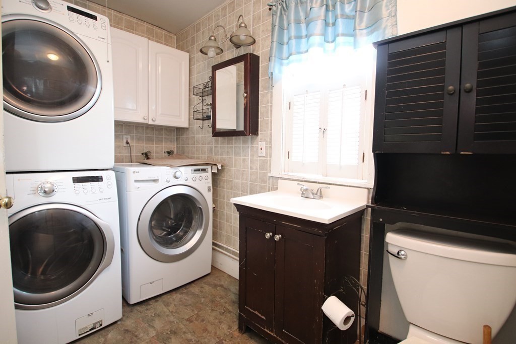 3 Linwood Street Saugus, MA 01906 - Photo 27 of 42 a utility room with sink dryer and washer