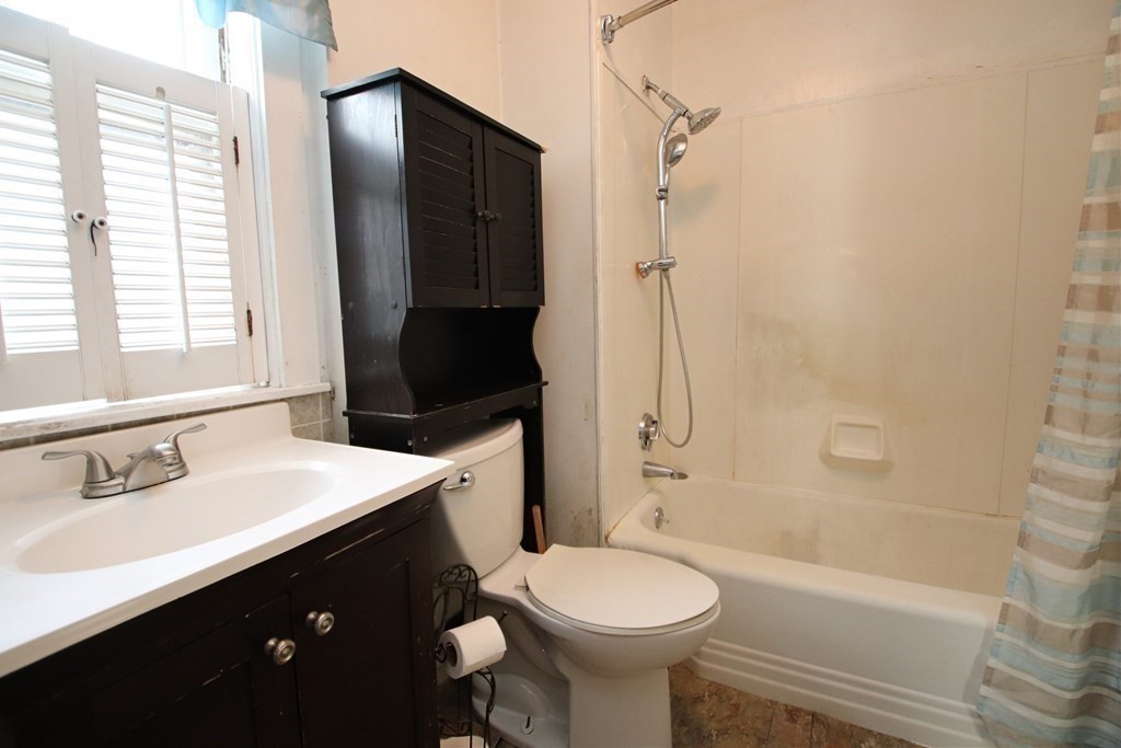 3 Linwood Street Saugus, MA 01906 - Photo 29 of 42 a bathroom with a sink a toilet and shower