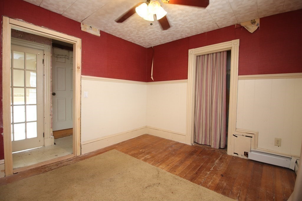 3 Linwood Street Saugus, MA 01906 - Photo 31 of 42 an empty room with a ceiling fan and window