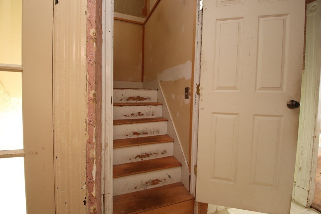 3 Linwood Street Saugus, MA 01906 - Photo 35 of 42 a view of a bedroom with a door and wooden floor