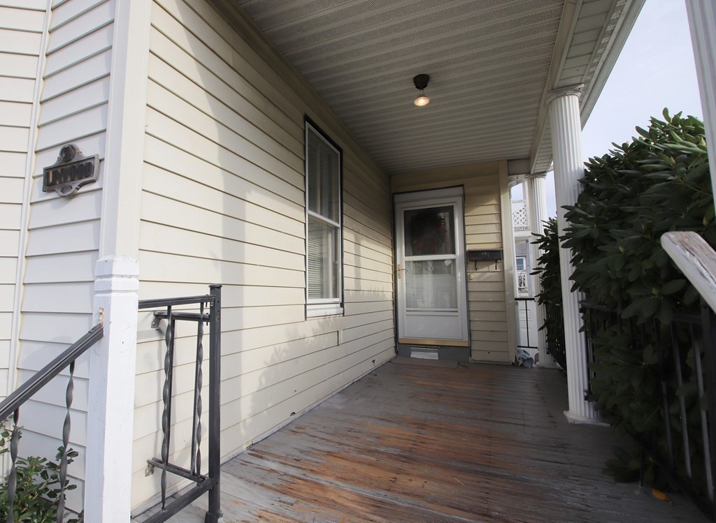 3 Linwood Street Saugus, MA 01906 - Photo 4 of 42 a view of a porch with wooden floor and stairs