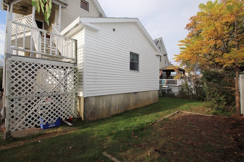 3 Linwood Street Saugus, MA 01906 - Photo 42 of 42 a view of a backyard with large trees