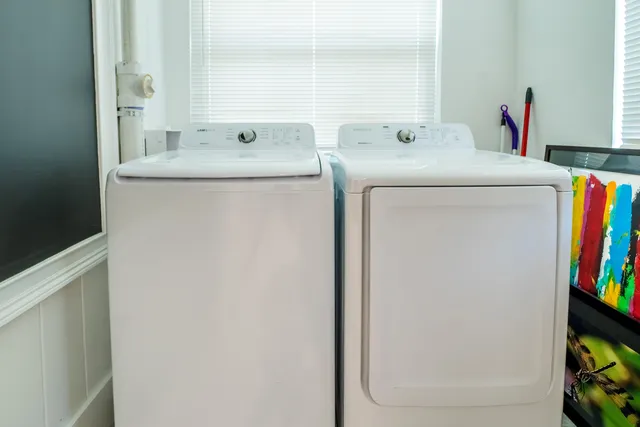 a utility room with dryer and washer