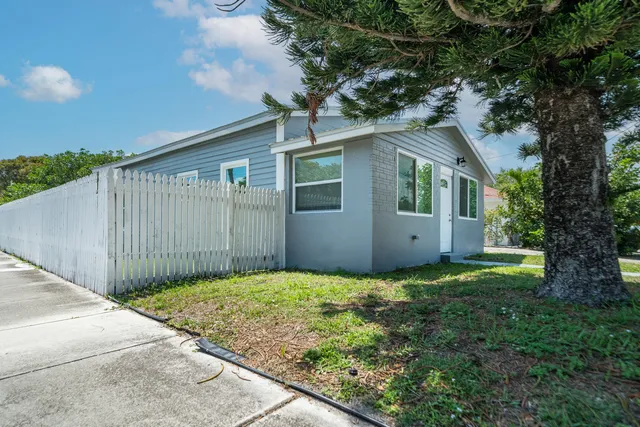 a backyard of a house with garage
