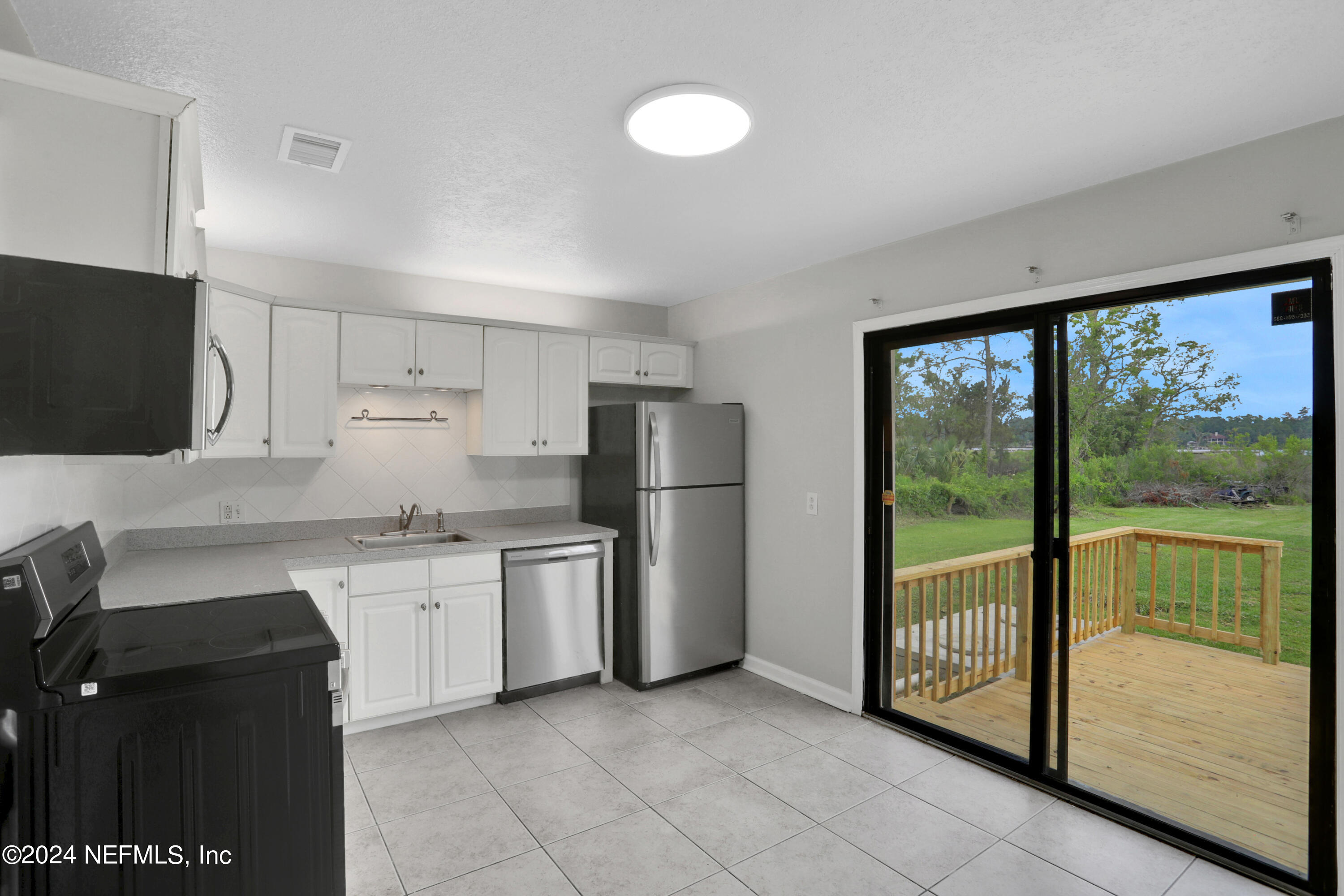2776 Broward Road Jacksonville, FL 32218 - Photo 9 of 24 Kitchen to deck