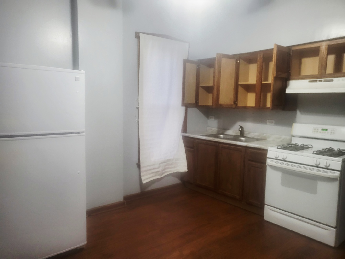 6643 South Laflin Street Chicago, IL 60636 - Photo 15 of 15 a kitchen with stainless steel appliances granite countertop a refrigerator and a stove