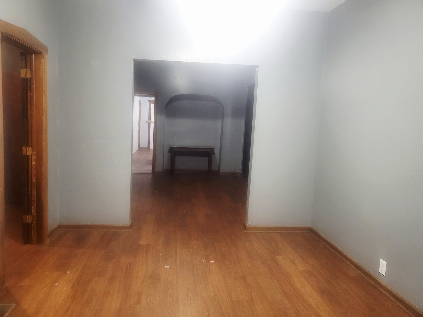 6643 South Laflin Street Chicago, IL 60636 - Photo 8 of 15 a view of a room with wooden floor and bench