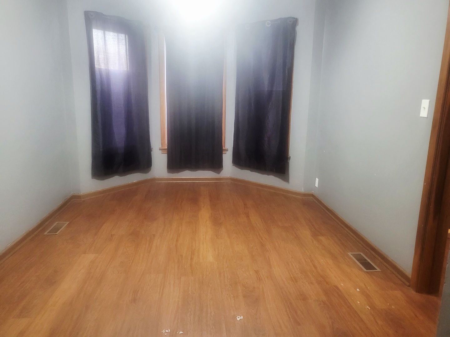 6643 South Laflin Street Chicago, IL 60636 - Photo 9 of 15 an empty room with wooden floor