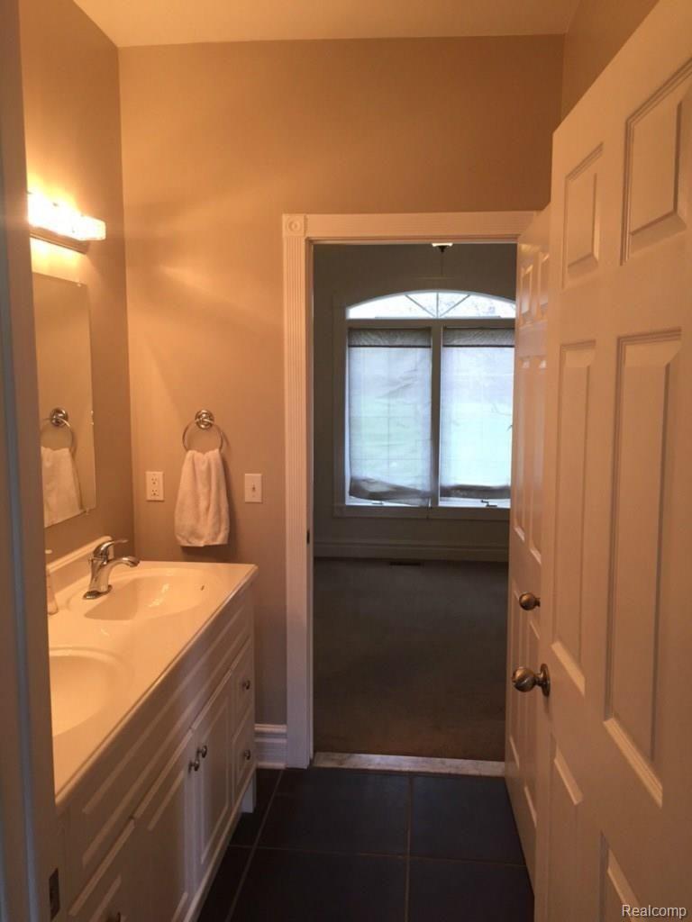 3663 Curdy Road Howell, MI 48855 - Photo 19 of 42 Bathroom off of 1st floor bedroom. Goes through to possible office or another bedroom.