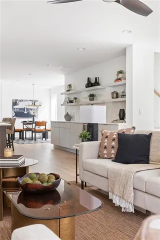 a bedroom with a large bed couch and a window