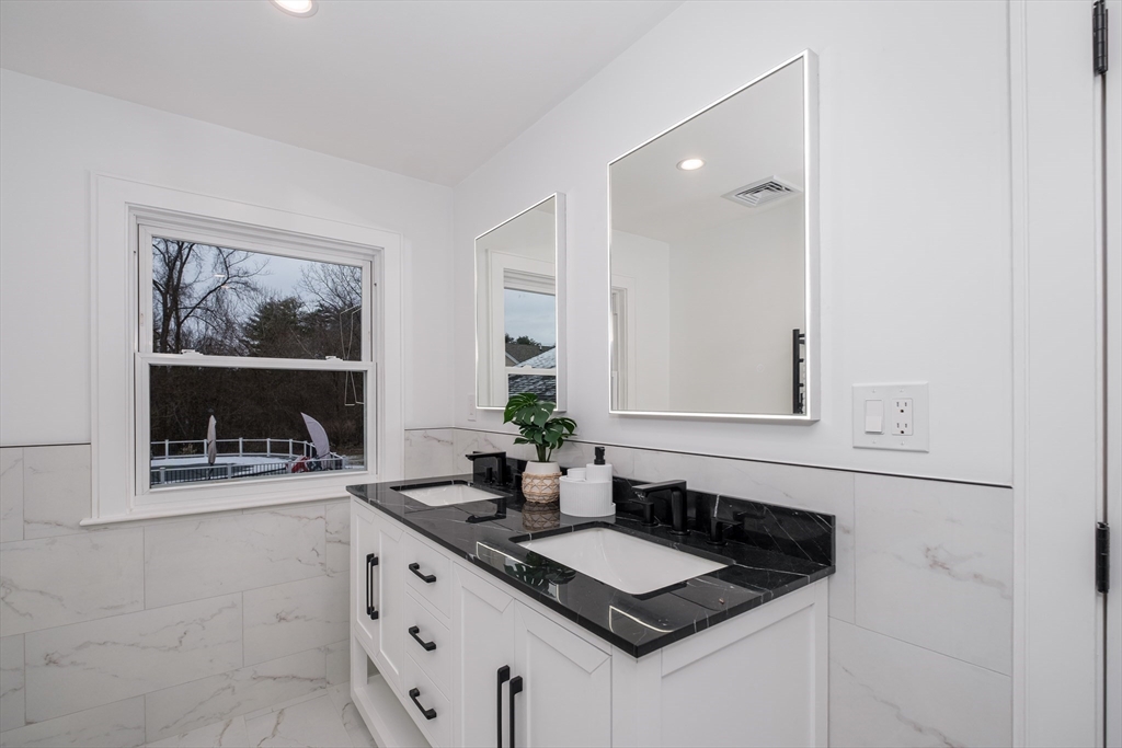 26 Harris Avenue Wellesley, MA 02481 - Photo 17 of 42 a white kitchen with sink and window