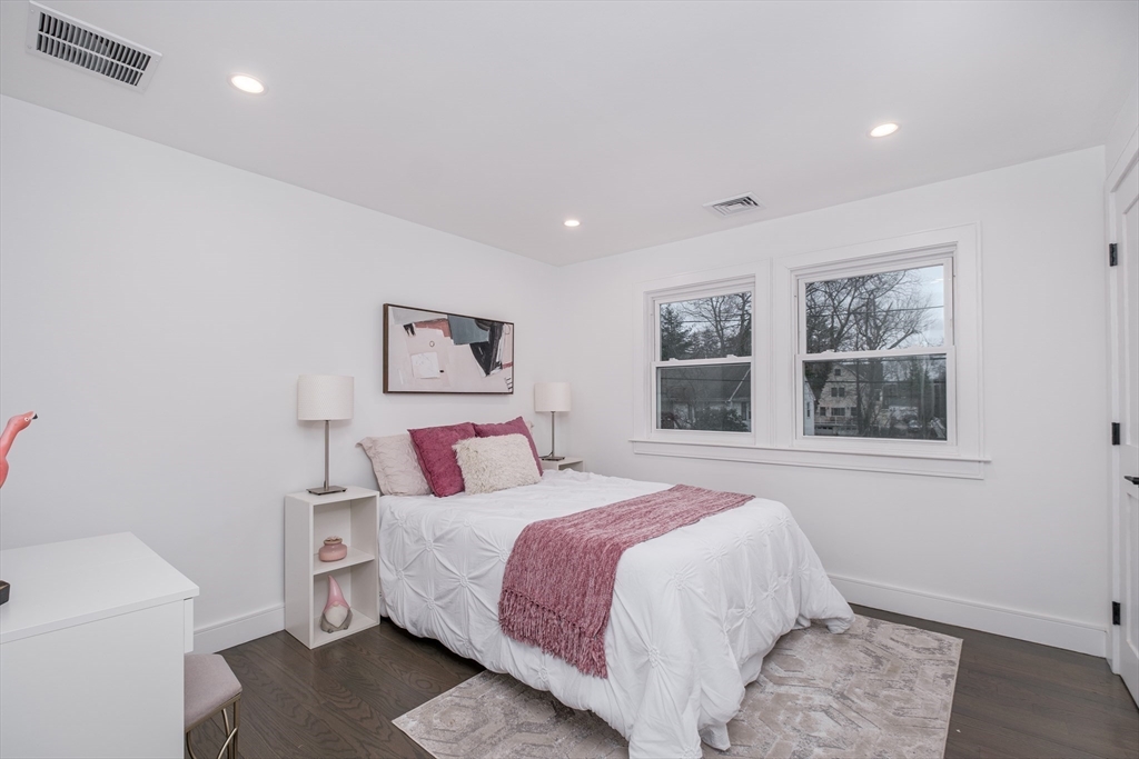 26 Harris Avenue Wellesley, MA 02481 - Photo 22 of 42 a bedroom with a large bed and a window