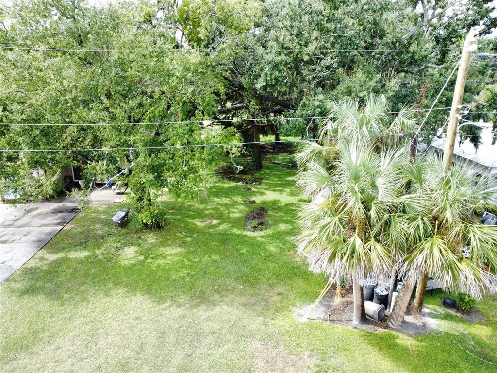 188 Mary Street Winter Garden, FL 34787 - Photo 23 of 35 a backyard of a house with yard table and chairs