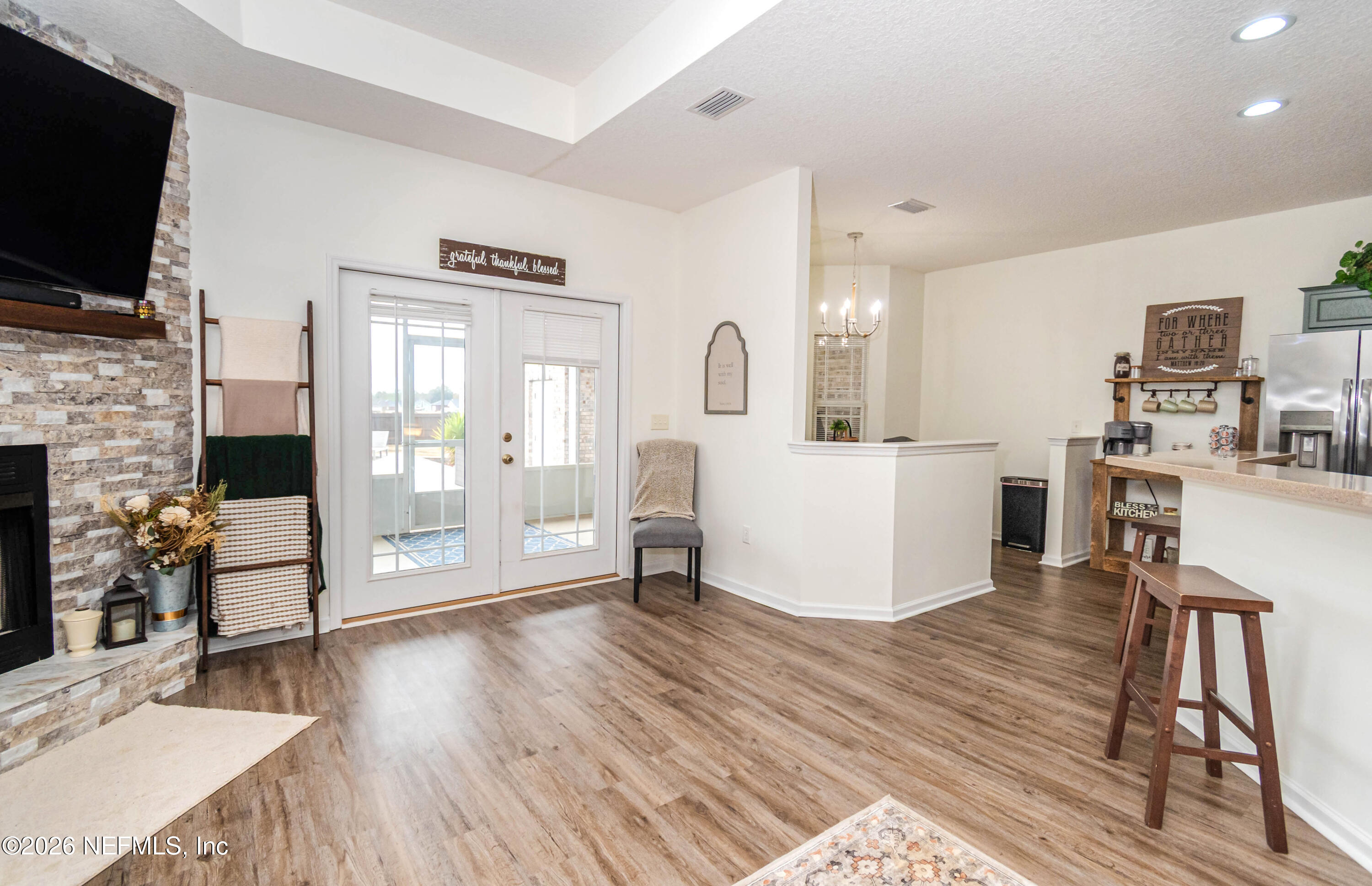 8139 Hunters Ridge South Glen St. Mary, FL 32040 - Photo 11 of 49 a living room with fireplace furniture and a flat screen tv