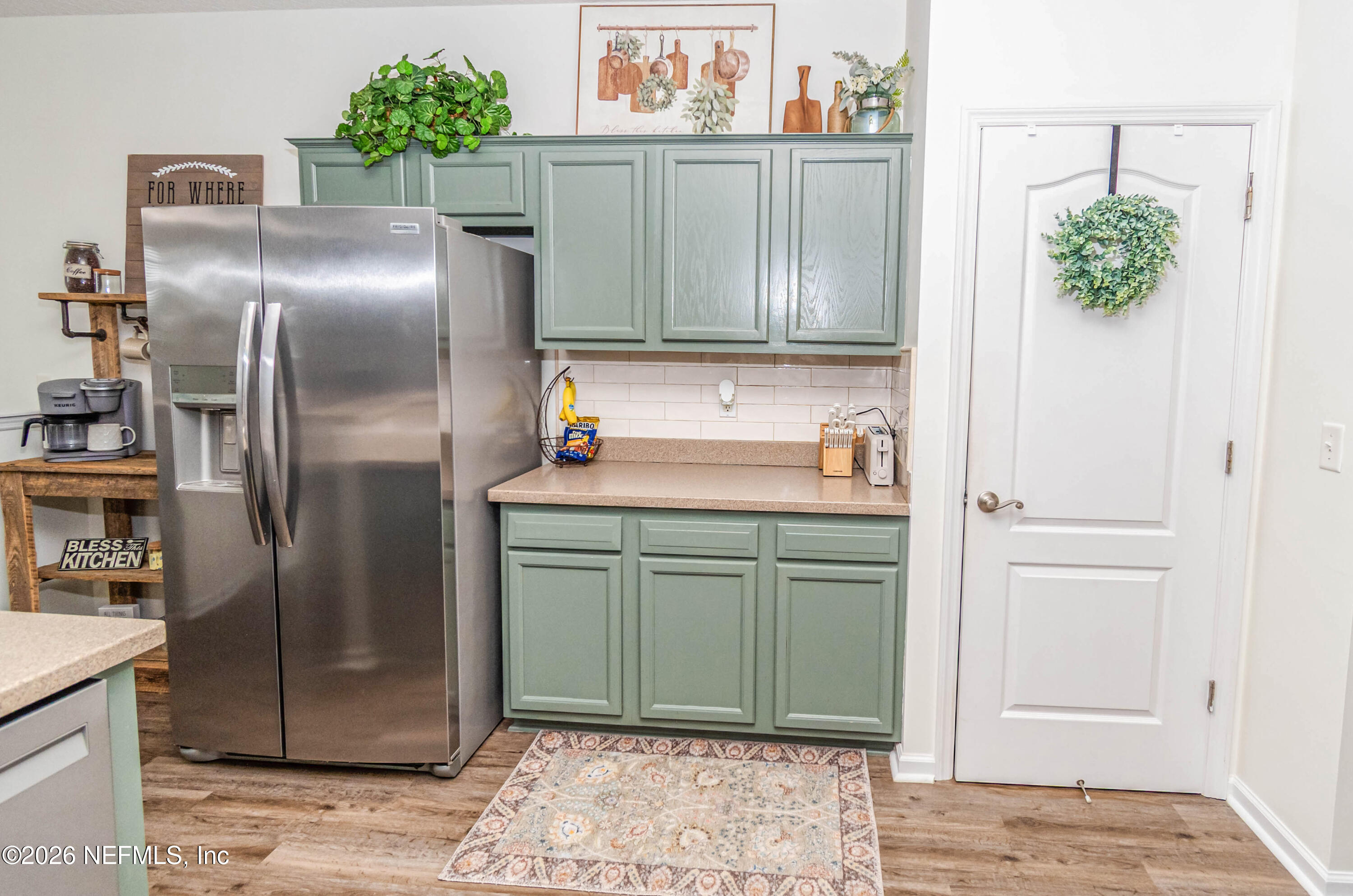 8139 Hunters Ridge South Glen St. Mary, FL 32040 - Photo 16 of 49 a kitchen with stainless steel appliances granite countertop a refrigerator and a stove