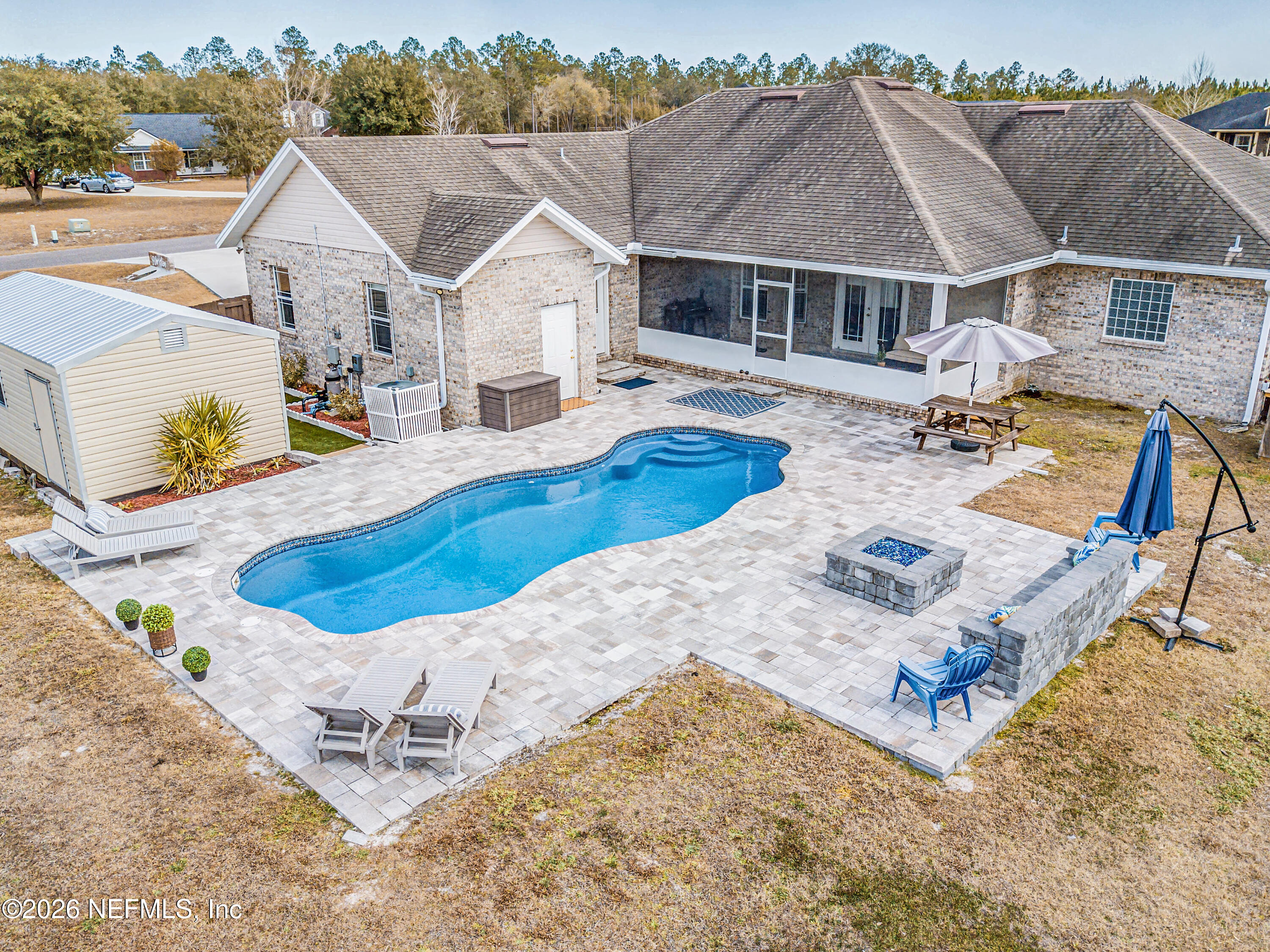 8139 Hunters Ridge South Glen St. Mary, FL 32040 - Photo 2 of 49 an aerial view of a house with swimming pool and porch