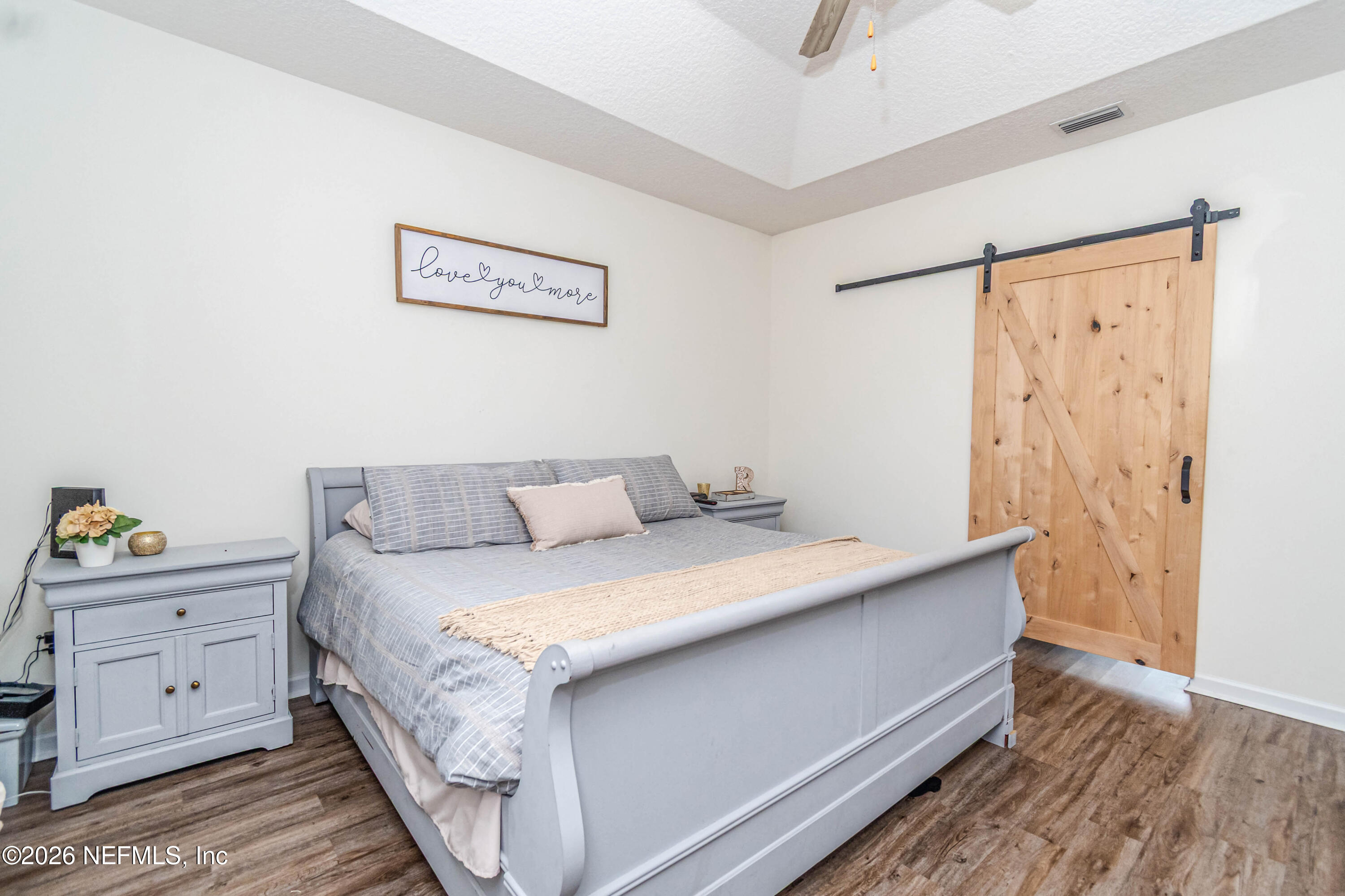 8139 Hunters Ridge South Glen St. Mary, FL 32040 - Photo 23 of 49 a room with a bed and a window