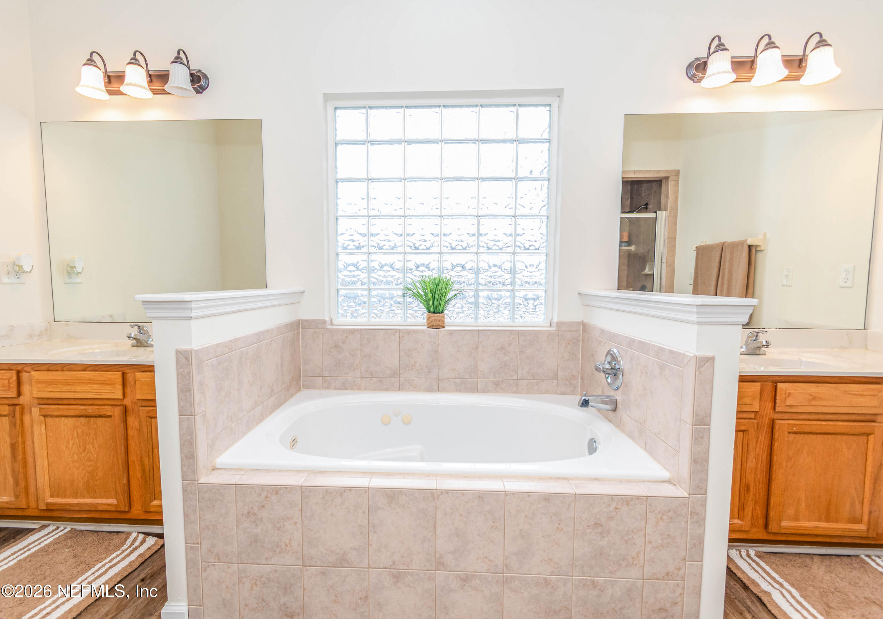 8139 Hunters Ridge South Glen St. Mary, FL 32040 - Photo 25 of 49 a white bath tub sitting next to a window