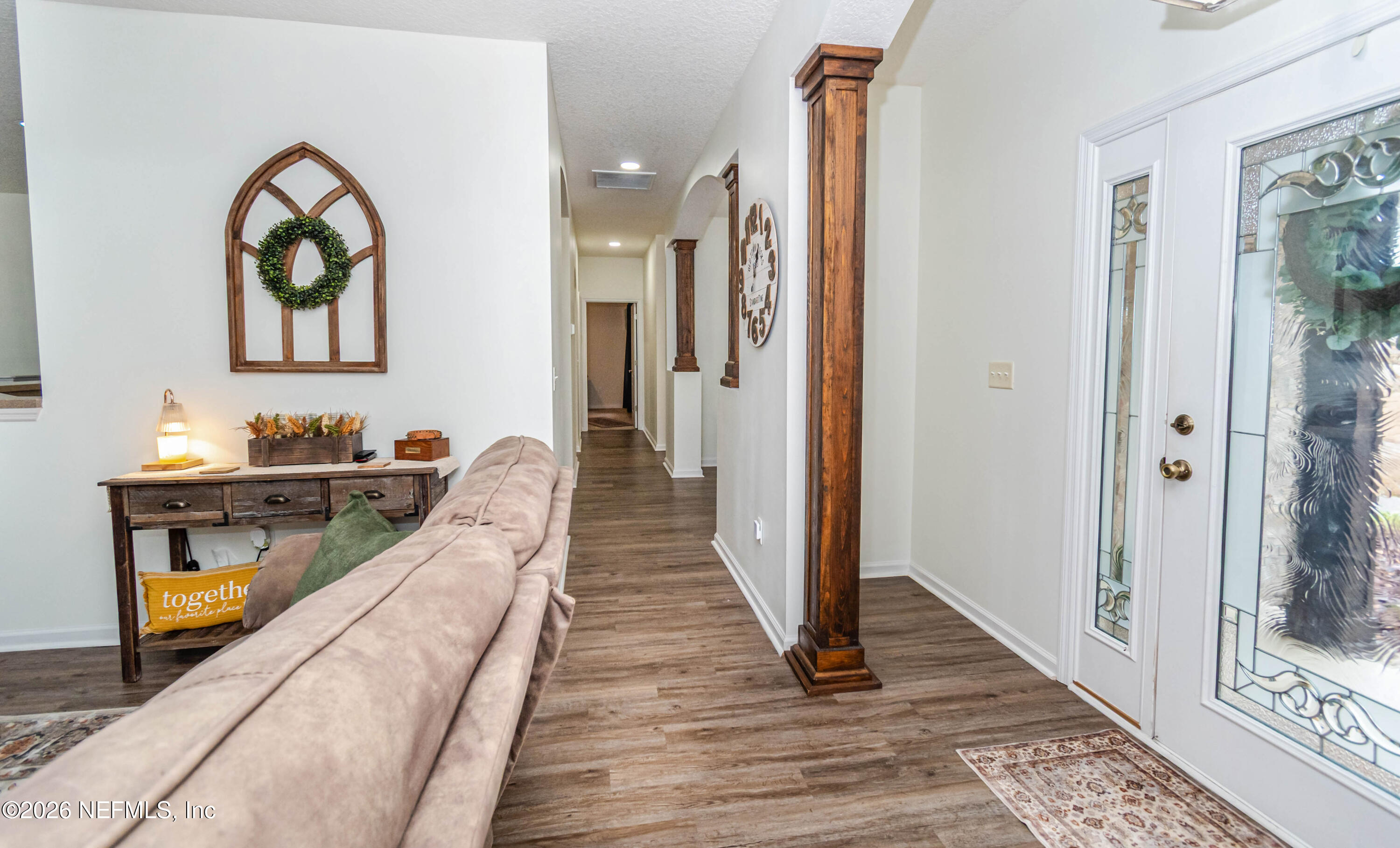 8139 Hunters Ridge South Glen St. Mary, FL 32040 - Photo 28 of 49 a view of a hallway with wooden floor and staircase